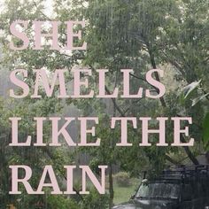 the words she smells like the rain are in front of an image of a truck