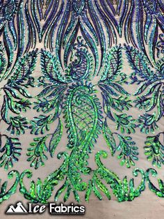 the back of a dress with green and blue sequins