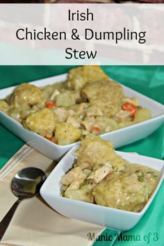 two white bowls filled with chicken and dumpling stew on top of a green table cloth