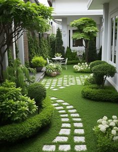 an outdoor garden with grass and stepping stones