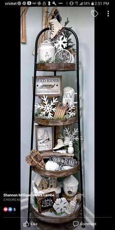 a display shelf with various items on it in a room that is decorated with snowflakes and other holiday decorations