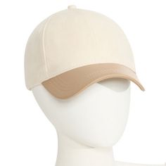 a white mannequin head wearing a baseball cap with a tan brimmed visor