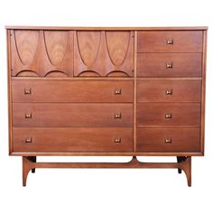 a large wooden dresser sitting on top of a white floor