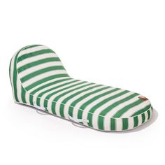 the green and white striped pillow is laying on top of it's back legs