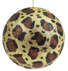 a leopard print ornament hanging from a string