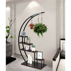 a corner shelf with potted plants on it and hanging planters in the corner