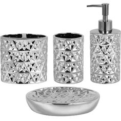 three pieces of silver bathroom accessories including soap dispenser and toothbrush holder