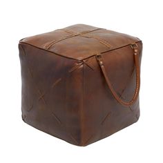 a brown leather box with straps on the front and bottom, sitting on a white background