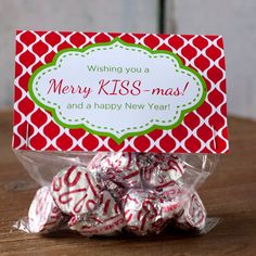 hers and kisses for all you do candy wrapper with red and green pattern on it