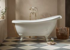 a white bath tub sitting on top of a checkered floor