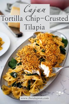 Two breaded tilapia filets on top of a pile of Cajun pasta and spinach. Tortilla Crusted Fish, Mash Potato Dinner Ideas, Tortilla Crusted Tilapia, Baked Tilapia Recipes, Tortilla Chip, Baked Tilapia, Potato Dinner, Tilapia Recipes