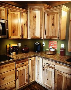 a kitchen with wooden cabinets and granite counter tops