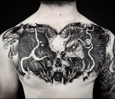 a man with tattoos on his chest has two birds in the shape of a heart