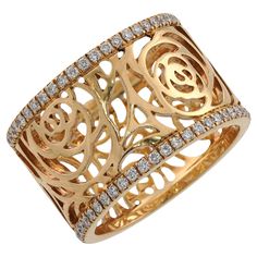 This splendid Chanel band from the elegant Camelia Ajoure Rose collection features the iconic floral openwork design crafted in 18k yellow gold and accented with round brilliant D-E-F diamonds. Made in France circa 2010s. Measurements: 0.38" (10mm) width. The ring size is 5.5 - EU 51. Non-resizable. Chanel Ring Women, Luxury Yellow Gold Diamond Ring With Filigree, Luxury Yellow Gold Diamond Filigree Ring, Chanel Ring, Rose Diamond, Chanel Jewelry, Gold Band Ring, Gold Band, Gold Bands