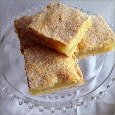 three pieces of cake sitting on top of a glass plate