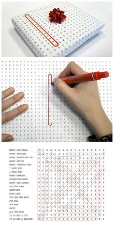 a hand is writing on a notebook with a red pen and an image of a cross stitch pattern