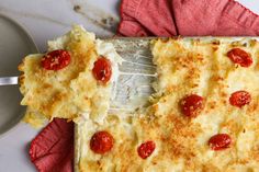 a slice of pizza on a red napkin with a fork