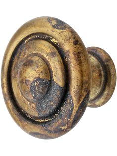 an old door knob that has been painted gold and brown with swirls on it