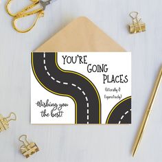 there is a card that says you're going places with a road on it