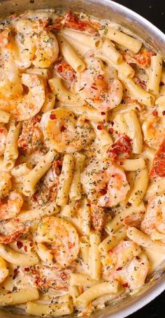 pasta with shrimp and tomato sauce in a pan