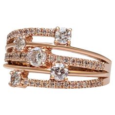 This exquisite ring features 0.80 carats of natural colored light pink and fancy light pink diamonds, beautifully arranged in a 14 kt rose gold setting. The delicate pink hues of the 49 diamonds are perfectly complemented by the warm, romantic glow of the rose gold band. Certified by GWLab for quality and authenticity, this ring is a stunning blend of elegance and sophistication, making it a perfect addition to any jewelry collection. Ring can be sized free of charge prior to shipping out. Ring Pink Gold Rings, Modern Wedding Rings, Fancy Light, Diamond Mines, Pink Diamonds, Fancy Lights, Art Deco Wedding Rings, Rose Pale, 14k Rose Gold Ring