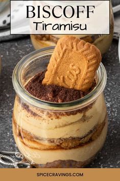 a close up of a dessert in a glass jar with the words biscoff tirami on it