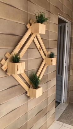 two wooden planters mounted to the side of a wall