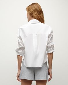 Endlessly versatile, the Khai is the go-to top every woman needs—perfect on its own or as a layering essential. Expertly tailored from premium cotton poplin—with stretch for ease—this billowy, relaxed silhouette is finished with a neat collar, a split V-neck and a single patch pocket. Throw it on over jeans, skirts, shorts—you name it.67% Cotton, 30% Polyamide, 3% SpandexProfessional dry clean onlyStyle #2312LSCP40714 Chic Cotton Shirt For Layering, Chic Poplin Top With Relaxed Fit, Chic Cotton Blouse With Fold Down Collar, Casual Poplin Blouse For Workwear, Summer Poplin Top With Spread Collar, Relaxed Fit Poplin Top For Work, Versatile Cotton Blouse For Work, Chic Poplin Top For Daywear, Effortless Cotton Workwear Top