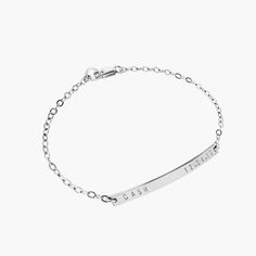 "Our minimal, modern and beautifully made sterling silver name bar bracelet, makes the perfect new mom bracelet! Personalize the bar to never be far from the one you love with a 'name and date' as shown, or personalize in your own way. We can hand stamp the bar with up to 18 characters on the front side, including: numerals, letters, the period mark, an ampersand, a hashtag, and heart. (Back stamping is available by special request). We use a heavy gauge metal to create all our nameplates which Minimalist Personalized Stainless Steel Name Bracelet, Minimalist Stainless Steel Name Bracelet, Dainty Engraved Bracelet For Everyday Wear, Dainty Engraved Bracelets For Everyday, Elegant Hand Stamped Sterling Silver Name Bracelet, Dainty Engraved Bracelets For Everyday Wear, Adjustable White Gold Name Bracelet For Everyday, Dainty Everyday Engraved Bracelets, Adjustable White Gold Name Bracelet