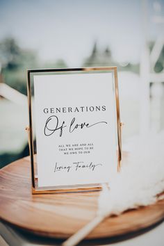 a sign that says generations of love on it sitting on top of a wooden table