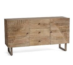 the sideboard is made from wood and has four drawers, one with metal legs