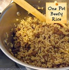 a pot full of rice with a wooden spoon in it and the words, one pot beefy rice