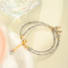 Elevate your energy with this Labradorite Bracelet, meticulously crafted to highlight the captivating beauty of labradorite. Each bracelet features mesmerizing labradorite beads, known for their protective and mystical properties. The beads are elegantly complemented by 18K gold on brass, adding a touch of luxury and sophistication. The combination of labradorite and gold creates a stunning visual contrast, making this labradorite bead bracelet a standout accessory. Ideal for those seeking to en Elegant Gold Crystal Bracelet For Meditation, Elegant Adjustable Labradorite Beaded Bracelets, Elegant Labradorite Beaded Bracelets, Gold Labradorite Beaded Bracelet, Spiritual Style, Spiritual Gold Beaded Bracelets With Moonstone, Elegant Gold Labradorite Beaded Bracelets, Gold Labradorite Gemstone Beads Bracelet, Gold Labradorite Bracelet As Gift, Elegant Gray Bracelets With Gemstone Beads