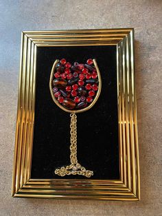 This piece depicts a bejeweled red wine glass in a lovely 4x6 gold frame. This wine will pair well with any room in the house. Each of my pictures is handmade from vintage and costume jewelry arranged into a unique piece of art and then framed. The background fabric is glued onto the frame's glass and the pieces are then glued on top of the fabric. No glass covers the picture. Everything used is purchased at thrift stores, tag sales, or donated to me from friends who clean out their jewelry boxe Vintage Jewelry Wine Glass, Broken Jewelry Crafts, Glass Crafts Diy, Wine Jewelry, Upcycle Jewelry, Button Art Projects, Old Jewelry Crafts, Background Fabric, Button Art