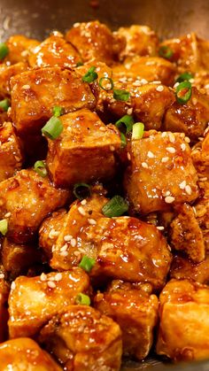 tofu with sesame seeds and seasoning in a bowl