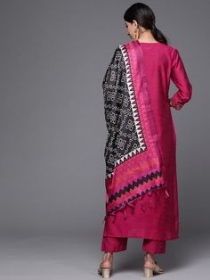 PRODUCT DETAILS Content - 1 Kurta, 1 Trouser & 1 Dupatta Fabric -Silk Blend Colors -Magenta Prints & Patterns -Front Top Embroidery Necklines -Round Sleeve Styles -Three-Quarter Sleeves with Hem Length - Calf Length Fit -Regular fit Size & Fit: Tailored to Perfection:The model wears a size S with the following measurements:Please check the last image above for a complete size chart. Material & Care:Material: Kurta Fabric: Silk Blend Trouser Fabric: Silk Blend Dupatta Fabric: Tabby silk Silk blen Bohemian Handloom Sets For Eid, Bohemian Pink Sets With Traditional Patterns, Bohemian Handloom Festive Sets, Traditional Pink Sets With Printed Border, Festive Pink Kurta With Printed Border, Pink Sets With Printed Border For Navratri, Pink Sets With Printed Border For Diwali, Diwali Pink Sets With Printed Border, Pink Sets With Printed Border For Festivals