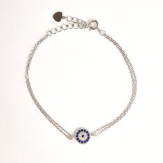 ♢ STYLE Subtle Zirconia Greek evil eye bracelet crafted from 925 Sterling Silver. Instantly brings a luxe touch to your everyday casual style. ♢ FEATURES & MATERIALS  :: Made of 925 Sterling Silver :: Blue and White Cubic Zirconia :: Double Chain made of 925 Sterling Silver :: Spring ring clasp made of 925 Sterling Silver ♢ SIZE & FIT :: Bracelet length adjustable from 15cm ( 5.9" ) to 18cm (7") :: The evil eye diameter is 7 mm(0.27") ♢ DELIVERY  :: This jewellery is shipped via the internationa Sterling Silver Evil Eye Bracelet In Silver, Silver Evil Eye Bracelets In Sterling Silver, Sterling Silver Evil Eye Bracelets, Silver Evil Eye Chain Bracelet Gift, Silver Sterling Silver Evil Eye Bracelet Dainty Style, Elegant Sterling Silver Evil Eye Bracelet, Silver Sterling Silver Evil Eye Bracelet, Dainty Style, Silver Evil Eye Bracelet With Cubic Zirconia, Dainty Silver Sterling Evil Eye Bracelet