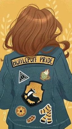 the back of a woman's jacket with patches on it, which reads hulllepuff pride