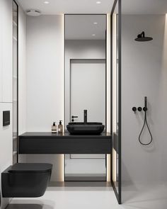 a black and white bathroom is shown in this image