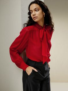 A contemporary rendition of a delectable classic, we reimagined the timeless pussycat bow blouse in a sheer silk georgette. The pinnacle of sultry and chic, the bow is fastened neatly at the neck for added sophistication. Style with a camisole underneath for a business casual look, or wear under a structured blazer and let the feminine bow peek from underneath. Mesh Bows, Bow Tie Blouse, Summer Wardrobe Essentials, Mesh Shirt, Casual Evening, Bow Blouse, Tie Neck Blouse, Fabric Bows, Tie Blouse