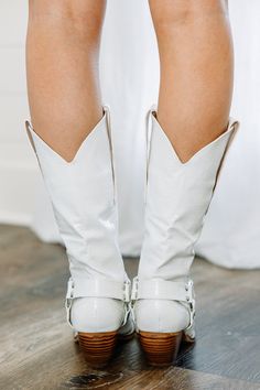 These Western inspired boots are so sassy and a little bit edgy! The croc impression give these boots a fabulous texture and the straps and metal hardware give these boots all the sass you could ask for! These boots feature croc imprint, metal hardware and strappy detailing, and a short heel. 
True to size. White Western Boots, Short Heels, Mint Julep Boutique, Mint Julep, Model Fits, Metal Hardware, Western Boots, Cream White, Riding Boots