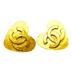 This is part of Chairish’s Costume Jewelry assortment.  Chanel Vintage Gold Plated CC Heart Clip on Earrings  *Marked 95 *Made in France *Comes with the original box  -It is approximately 1.25" x 1.25". -This is a very iconic vintage Chanel item. -In a very good  vintage condition. Designer Heart-shaped Formal Earrings, Vintage Double Heart Earrings For Anniversary, Designer Heart-shaped Earrings For Gift, Designer Heart-shaped Earrings As Gift, Designer Heart Shaped Earrings For Gift, Designer Heart Shaped Earrings For Formal Occasions, Chanel Stud Earrings, Heart Clip, Pink Stud Earrings