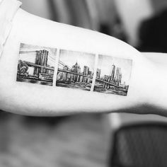 a black and white photo of a city skyline on the left arm with three photos in it