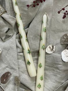 Hand-painted festive candle pair Winter Candle Painting, Paint Taper Candles, Painted Christmas Taper Candles, Painted Christmas Candlesticks, Christmas Painted Taper Candles, Hand Painted Candles Christmas, Candle Painting Ideas Christmas, Painting Christmas Candles