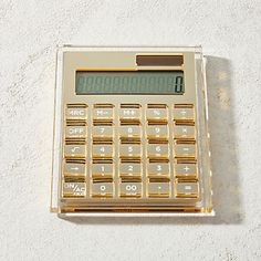 a calculator sitting on top of a white table