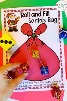 the roll and fill santa's bag activity is shown with dices