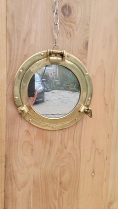 "Shipping is NOT Free, please read below how to get a shipping quote.  Vintage Nautical Brass Porthole Mirror  Vintage round mirror in a brass porthole frame with cabinet door opening. It is a functional porthole mirror that will open and close by loosening dog ears. Use it as a home decor piece or a cover for your secret stash!  Circa 1980  Dimentions D 11.5\"  D Mirror Face 7.5\" Good vintage condition Please be aware that most of the items are vintage/antique and may have small defects or signs of age. However, we strive to provide clear and honest descriptions and photographs for every item. Please contact us if you need any additional photos/information. SHIPPING IS NOT FREE:     Please text 847-533-1945 with a photo of the item you are trying to purchase, City, State and Zip for a sh Jute Rope Mirror, Vintage Car Garage, Porthole Mirror, Rope Mirror, Dog Ears, Mirror Vintage, Door Opening, Well Pump, Nautical Wall