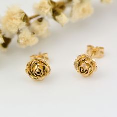 Rose Earrings, Gold Flower Earrings, 9k Gold Stud Earrings Dainty handcrafted solid gold rose stud earrings. They would make a perfect anniversary gift. * Material: 9ct Rose or Yellow eco-gold * Size of Rose: Approx. 0.8cm (0.3in) diameter * Finish: Choose from: 9ct rose, yellow gold or white gold * Earring Type: Stud Earrings with butterfly back * Ready to Ship in 5 business day * Made in the United Kingdom Please allow for slight variations in size as these earrings are completely handmade and Cheap Everyday Rose Gold Earrings, Affordable Rose Gold Flower Earrings, Cheap Single Flower Earring, Cheap Rose Gold Piercings For Gifts, Delicate Flower Earrings Cheap, Cheap Rose Earrings, Simple Rose Earrings, Cheap Rose Gold Flower Earrings For Spring, Cheap Rose Gold Metal Flower Earrings