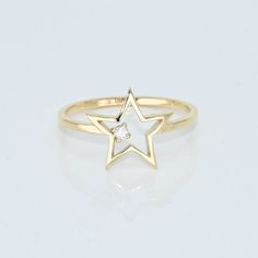 14k Solid Gold Dainty Star Ring, Real Gold Open Star Ring with premium grade D Color (colorless) VS/SI clarity moissanite.  💙 Our jewelry is handcrafted with love and great care at San Francisco Bay! All of our items are 14k stamped for authenticity. 💙 You will receive them exactly as pictured. We don't use any filters, all photos are authentic and unedited.   💙 Dimensions: Band thickness: 1.5 mm, Star: 12 mm. 💙 The ring material is 14k Solid gold, should not be confused with gold plating or filling. It won't tarnish or fade over time. 💙 We're offering the finest quality in solid gold jewelry. 💙 Quick shipping - Your order will be handcrafted and shipped in a few days. 🎁 They are delivered in a nice jewelry box, ready to be presented as a precious gift. 💎 Moissanite is the best alt Star Shaped Brilliant Cut Yellow Gold Jewelry, Celestial Yellow Gold Diamond Ring In Star Shape, White Gold Star-shaped Diamond Ring For Formal Occasions, Celestial Star-shaped Yellow Gold Diamond Ring, Celestial Yellow Gold Star-shaped Diamond Ring, Formal White Gold Star-shaped Diamond Ring, Star-shaped Diamond Ring In White Gold, White Gold Star-shaped Diamond Ring, Star-shaped Brilliant Cut White Gold Ring