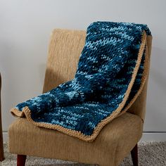 a chair with a blanket on top of it